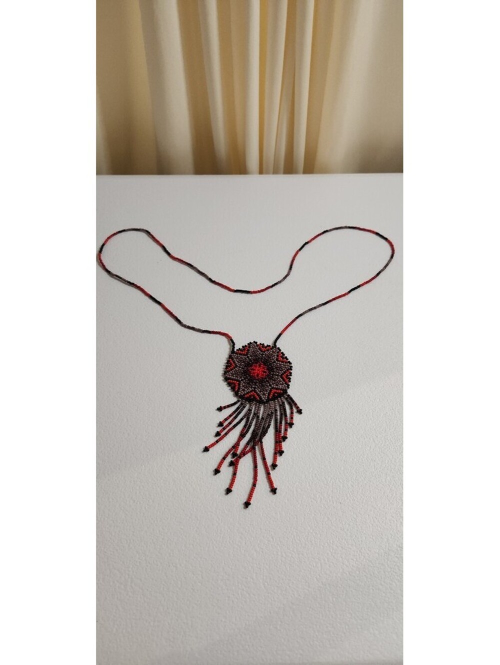 Handcrafted Beaded Pendant Necklace with Red and Black Pattern